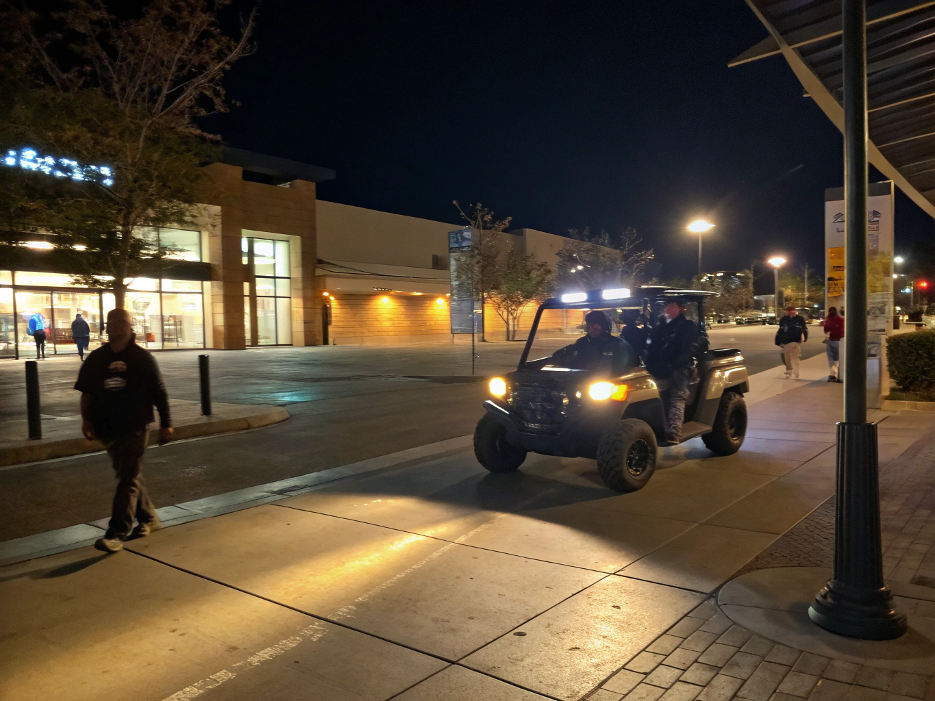 Marked patrol vehicle conducting nighttime property inspection