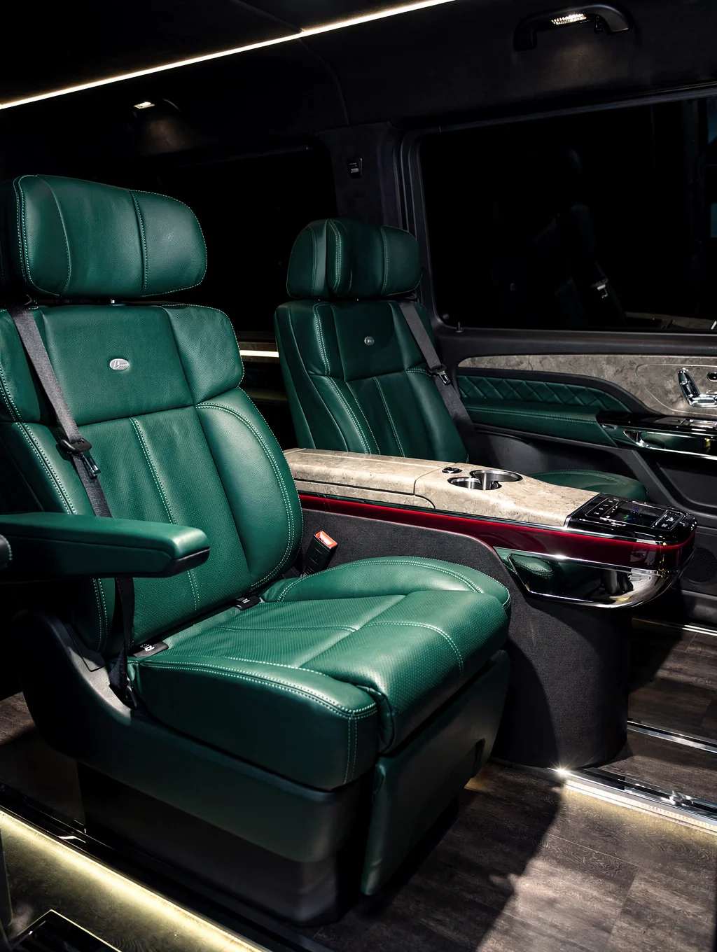 Refined luxury interior of executive Sprinter with leather captain chairs