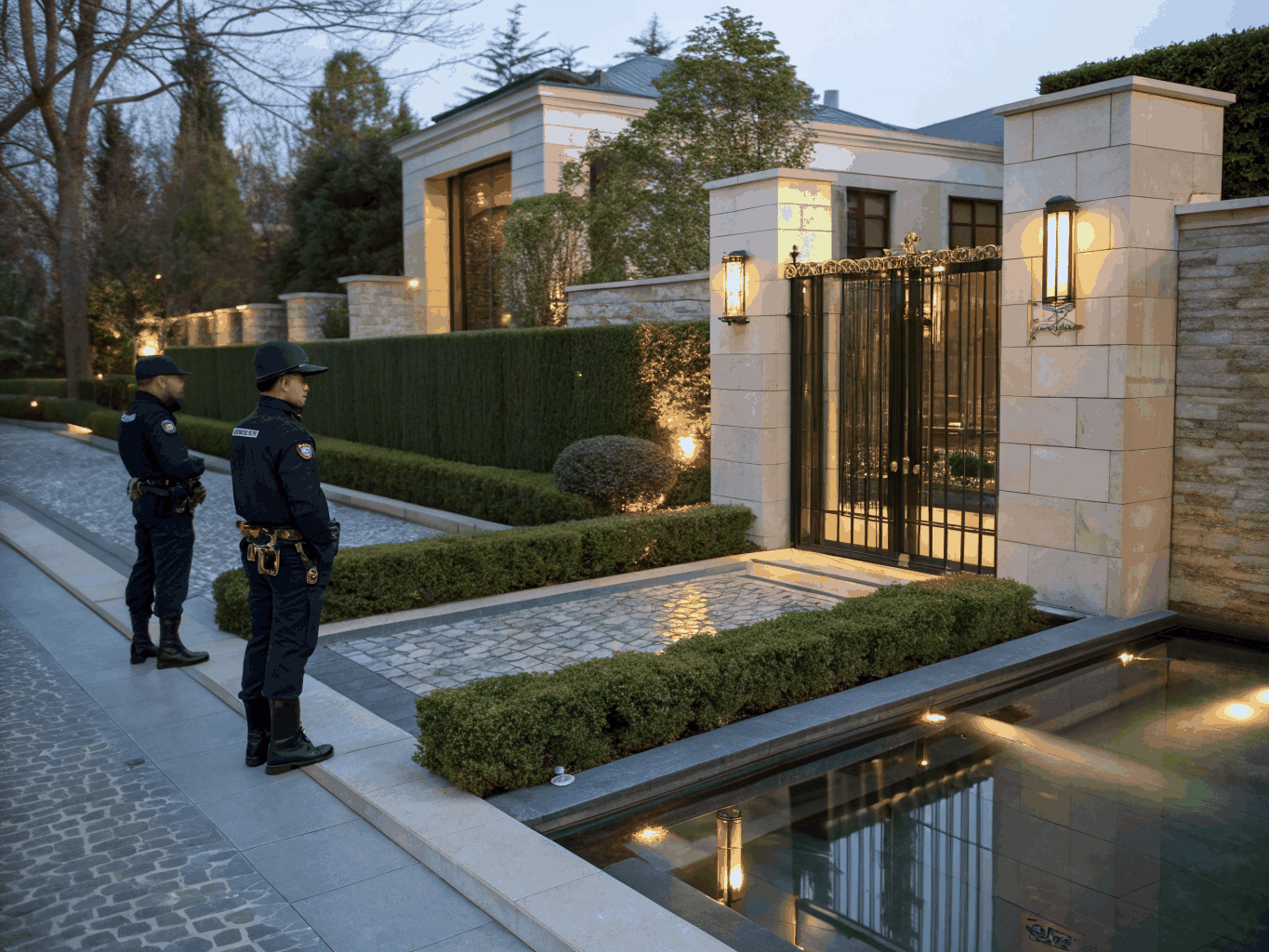 Professional on-site security guard standing post outside a residence